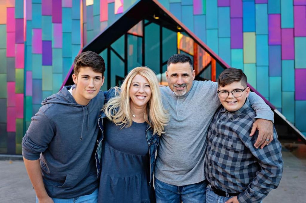 Susan Day is surrounded by her family, from left, son Jackson, husband Jason, and son Jace.