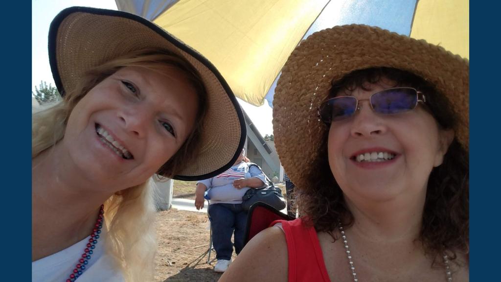 Rebecca Martin and her sister lounge on the beach.