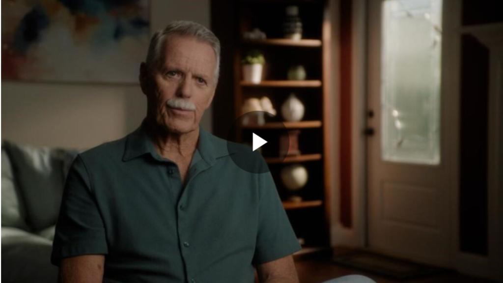 Man in green shirt being interviewed