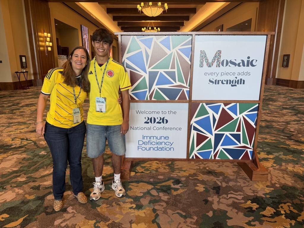 Alejandro and mom at conference