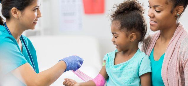 little girl getting a blood test