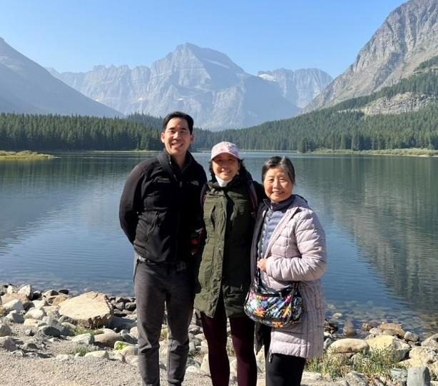 Irene Chen with brother and mother near mountains