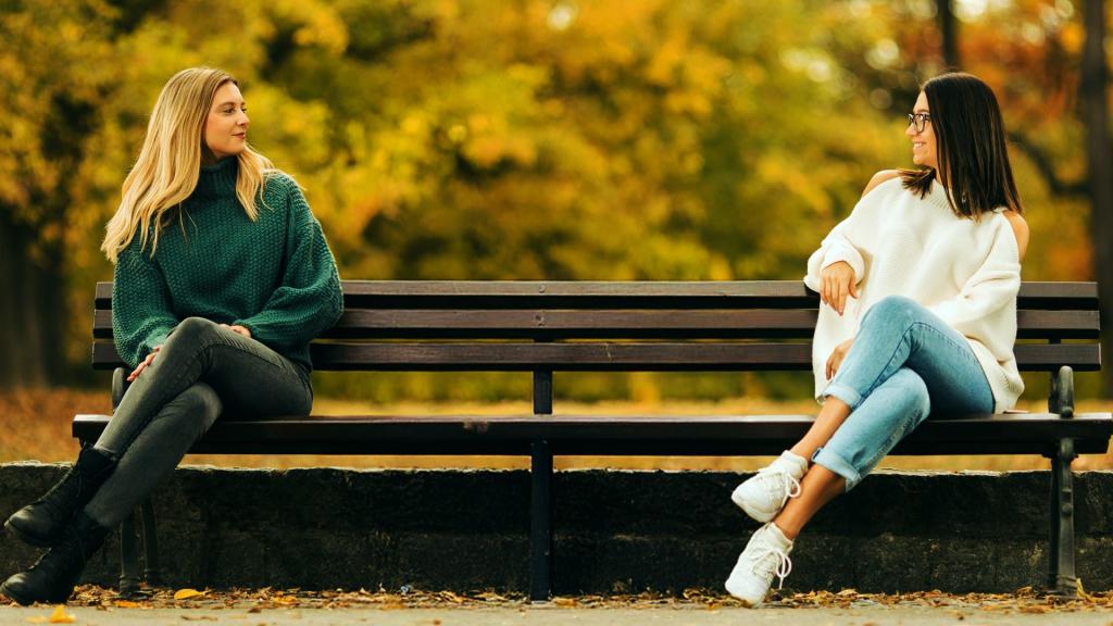two ladies sitting on a bench