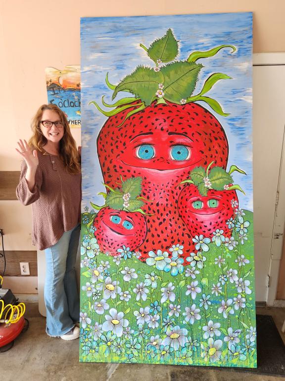 Katherine Taylor with strawberry mural