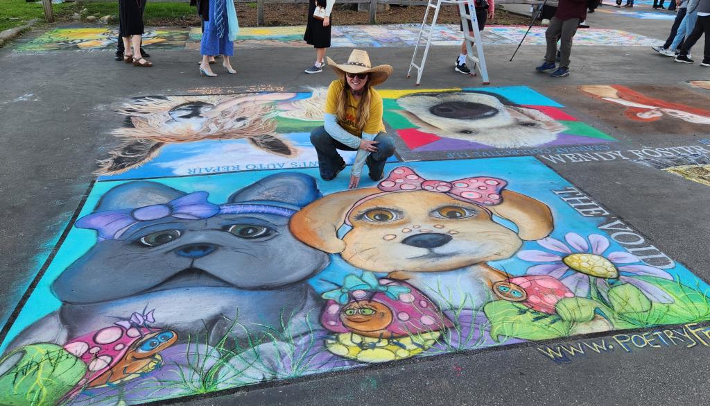 Katherine Taylor with dogs mural