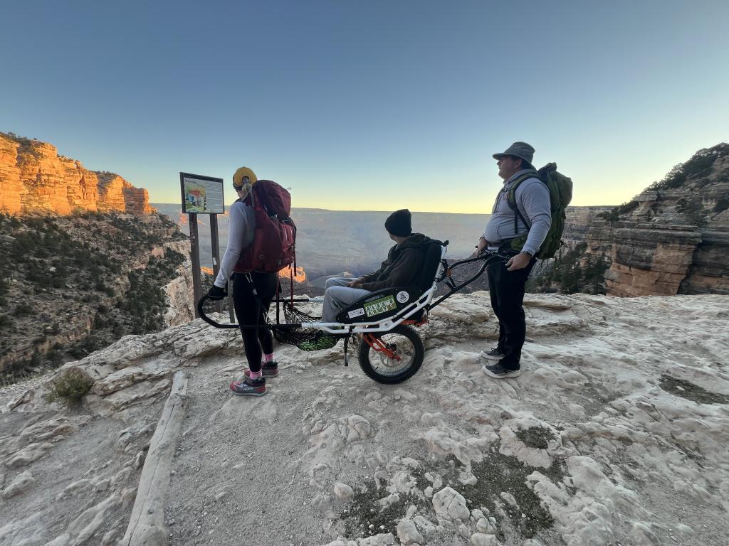 Alex Oliver overlooking Grand Canyon with parents