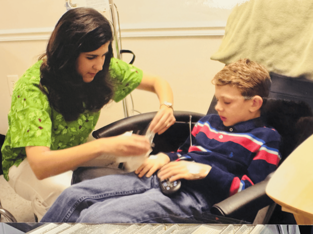 Hayden Scott getting his Ig infusion from a nurse