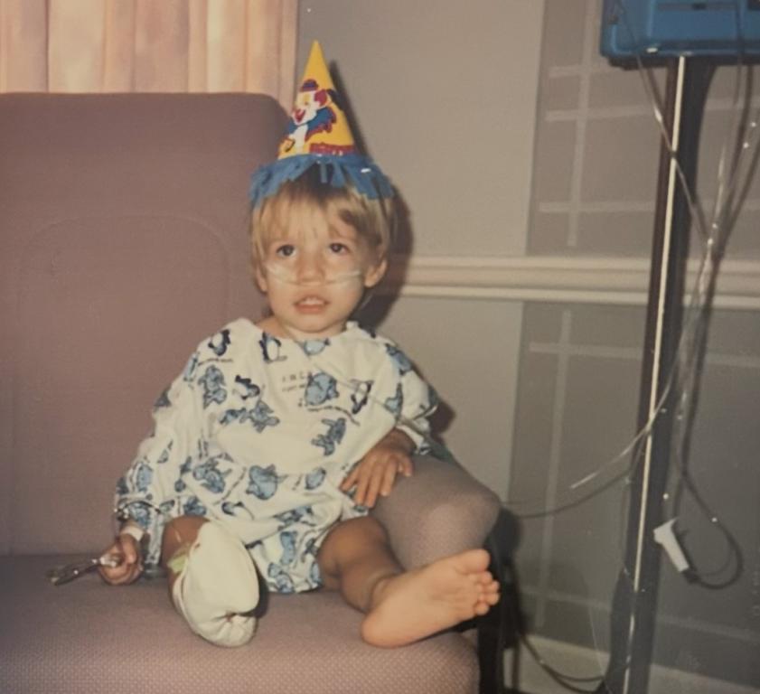 Chris Simpson as a toddler celebrates his birthday in the hospital