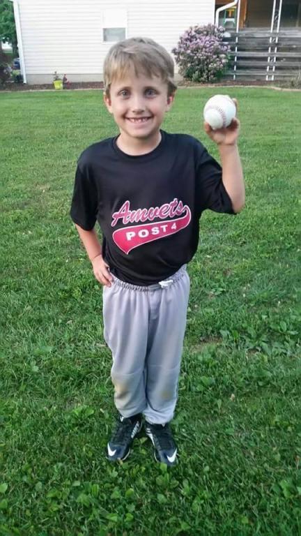 Thaddaeus Brown in his baseball uniform holding a ball.