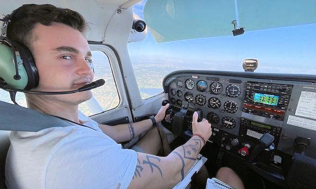 Josh Cash pilots a small plane.