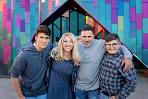Susan Day is surrounded by her family, from left, son Jackson, husband Jason, and son Jace.