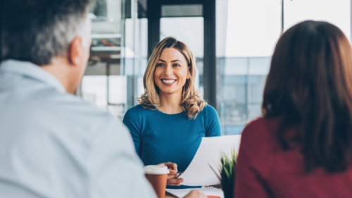 Smiling insurance worker helping couple