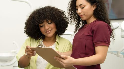 Doctor helping a patient review paperwork