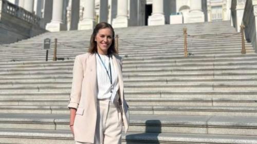 Jennifer Harry stands in front of the Capitol