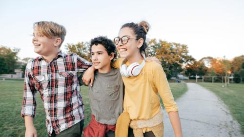 Three middle school kids hanging out.