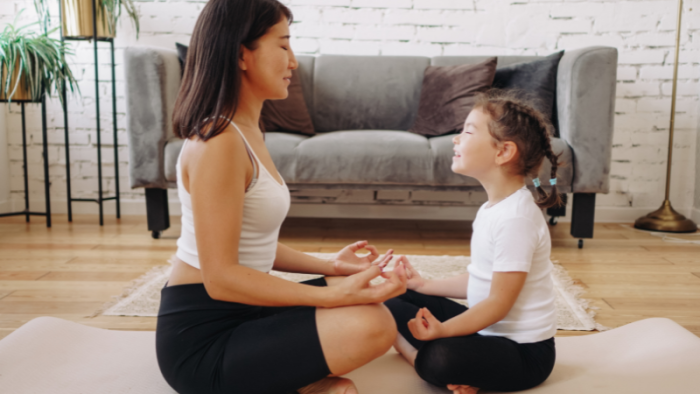 Parent and child completing meditation