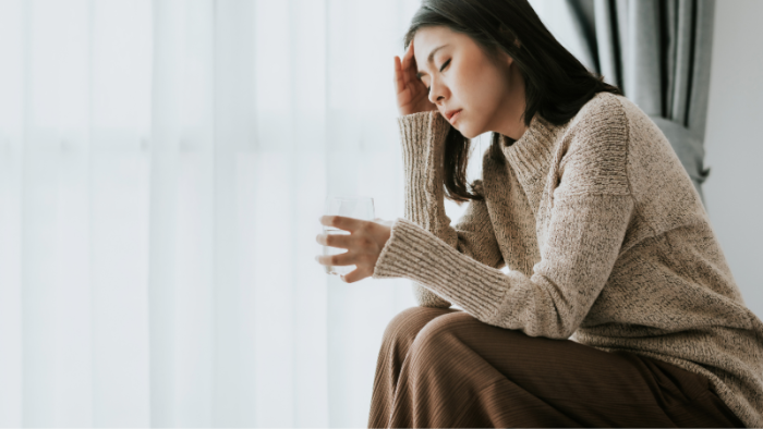 Woman holding her head